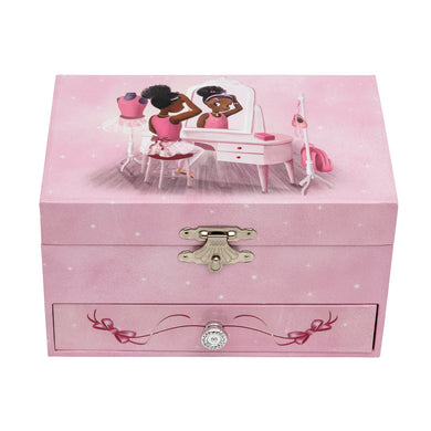 Pink music box with a image of Nia Ballerina who is a black ballerina sitting down at a dressing table.
